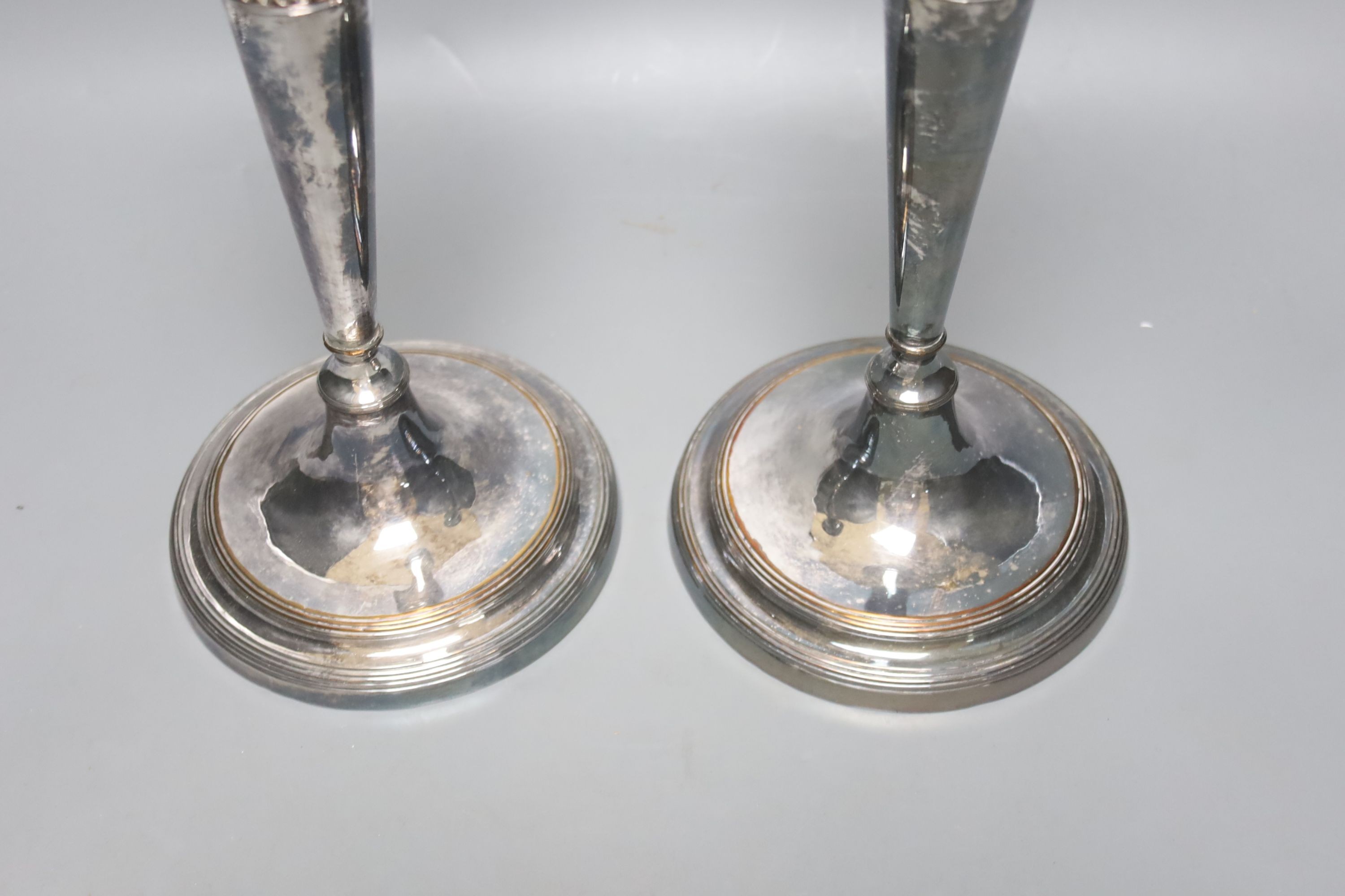 A pair of silver plated candlesticks, height 29cm